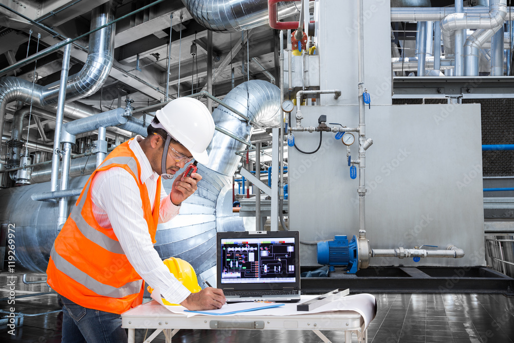 Electrical engineer working at control room of thermal power plant ...