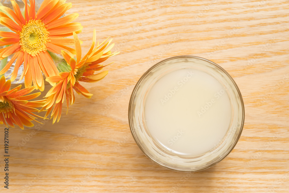 Amazake, sweet drink made from fermented rice on wood background Amazake, sweet drink made from fermented rice on wood background