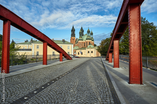 Steel bridge over the river Warta and the towers of the cathedral in Poznan.