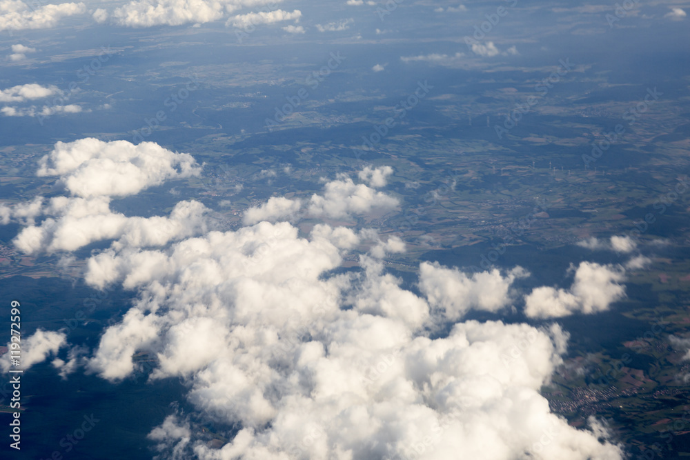 Fluffy clouds over the earth, the landscape. The scenic sky during sunset, the view from the air. Fluffy clouds over the earth, the landscape. The scenic sky during sunset, the view from the air.