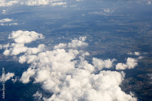 Foto Fluffy clouds over the earth, the landscape