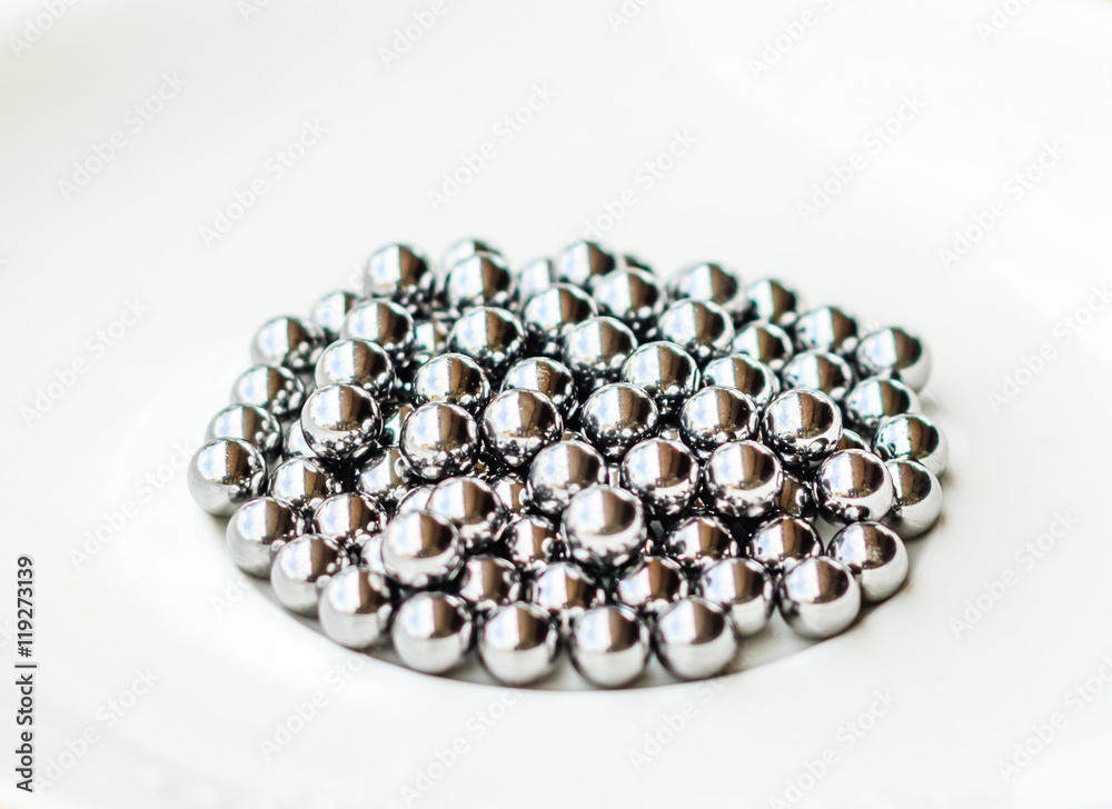 bearings in a dish on wooden table