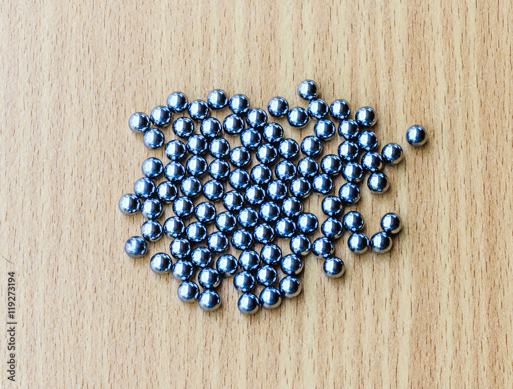 bearings in a dish on wooden table