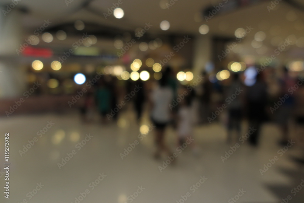 Shopping mall, modern trade with people in blur background with bokeh