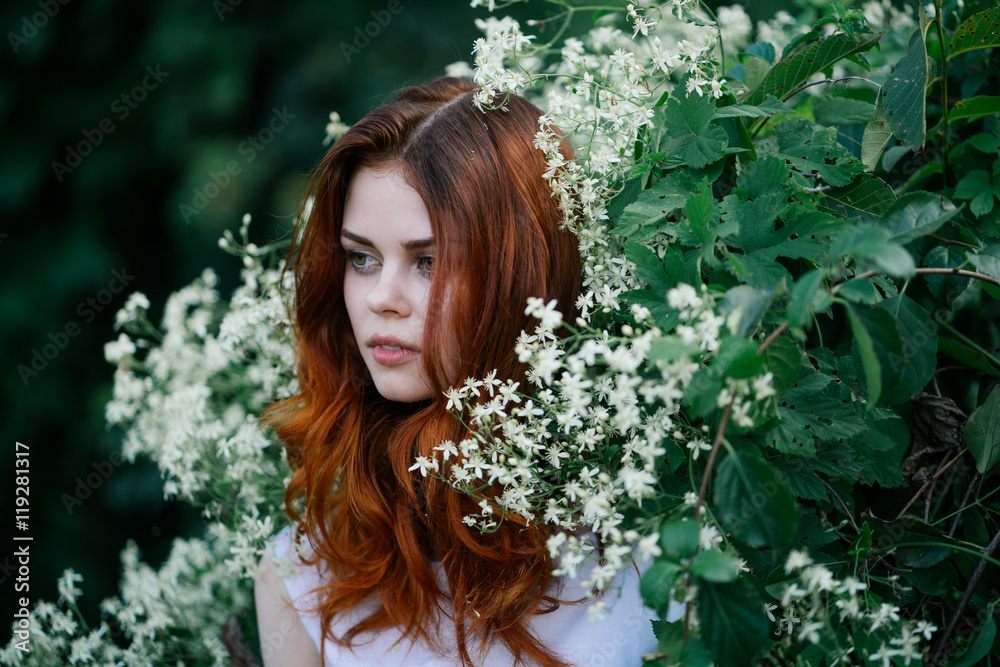 beautiful young woman in a park on a background of flower
beautiful young woman in a park on a background of flower