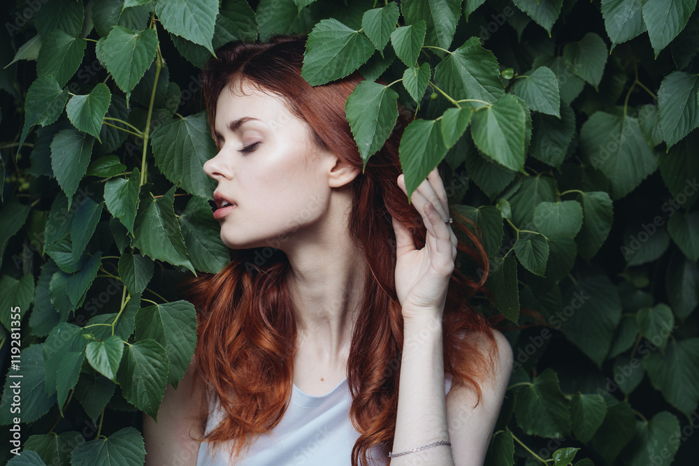 portrait of a beautiful woman on green summer leaves
portrait of a beautiful woman on green summer leaves