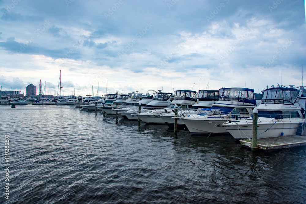 Fototapeta premium Down the Pier/A beautiful image of yachts docked in Fells Point, MD.
