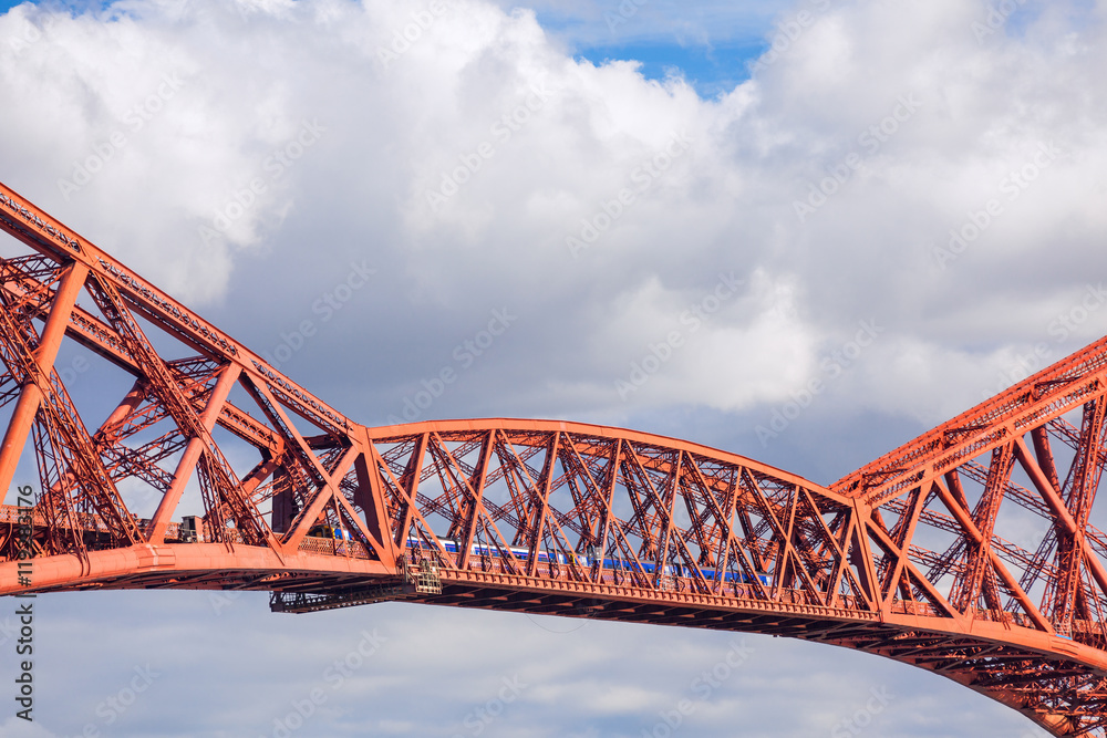 Train crosses the Forth Railway Bridge in Edinburgh, Scotland