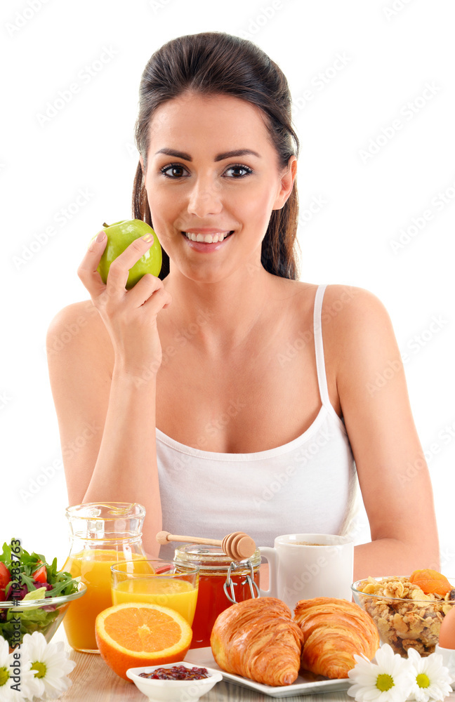 Young woman having breakfast. Balanced diet Young woman having breakfast. Balanced diet