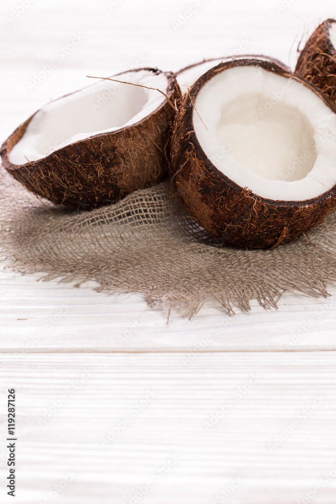 Coconut on wooden table. Coconut on wooden table.