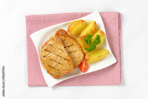 Grilled pork chops with potato wedges