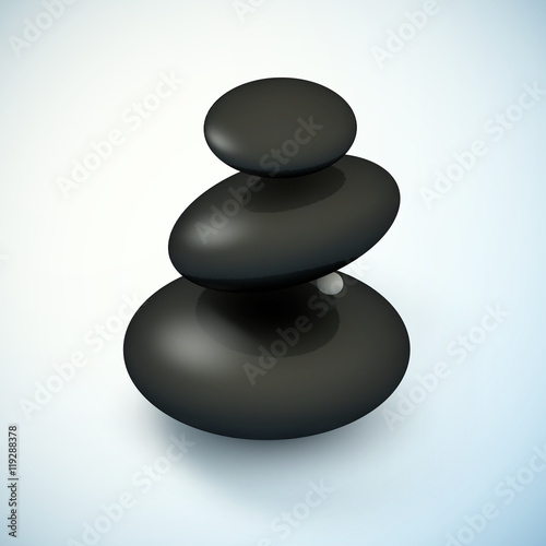 Black spa rocks pyramid with frangipani flower