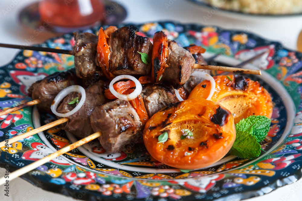 Lamb kebab marinated with yoghurt  apricots served on traditional plate
