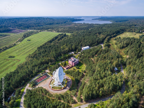 Aerial view radio telescope in forest at countryside in saint-Petersburg Russia photo