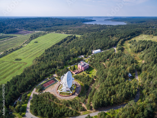 Aerial view radio telescope in forest at countryside in saint-Petersburg Russia photo