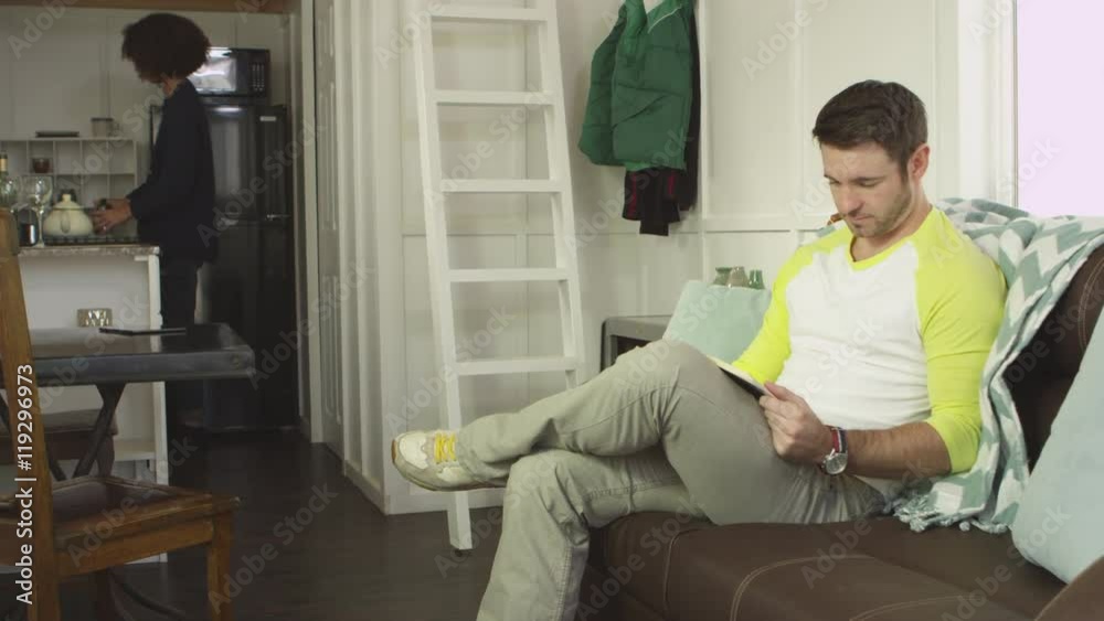 Young couple hanging out in tiny home