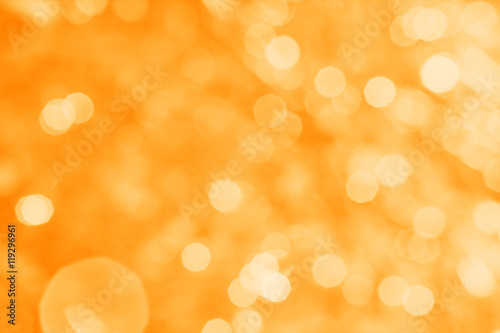 Abstract orange background with white bokeh