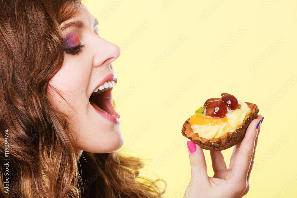 Closeup woman eating fruit cake sweet food Closeup woman eating fruit cake sweet food