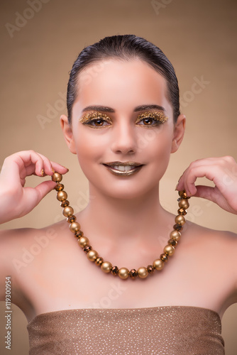 Elegant woman with jewellery in fashion concept