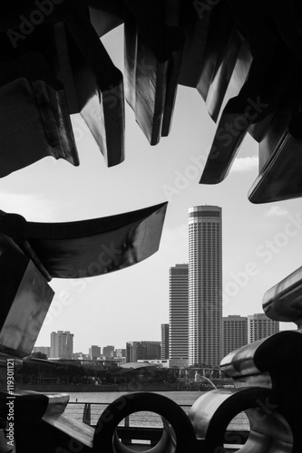 Buildings Through Hole of Sculpture