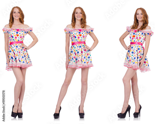 Young woman in polka dot dress isolated on white