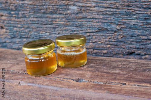 Honey jar on a wooden table