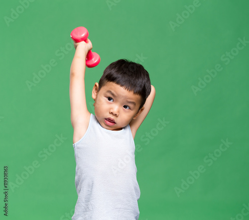 Asian boy lifting up dumbbell