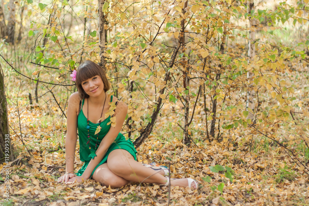 Beautiful girl in autumn park
