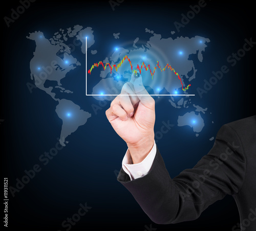 Businessman hand writing a business graph on a touch screen inte
