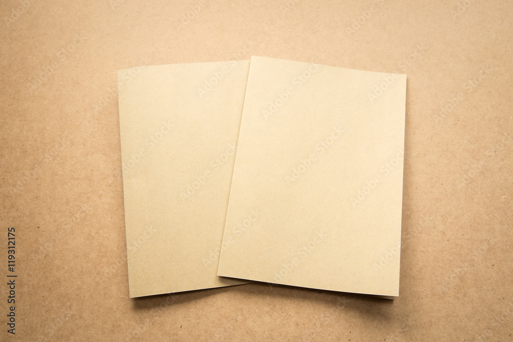 Brown paper note on business wood desk with copy space. Brown paper note on business wood desk with copy space.