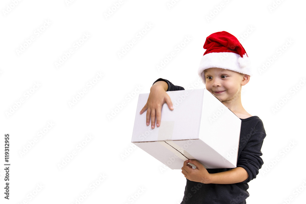 boy in Santa Claus hat holding a box boy in Santa Claus hat holding a box