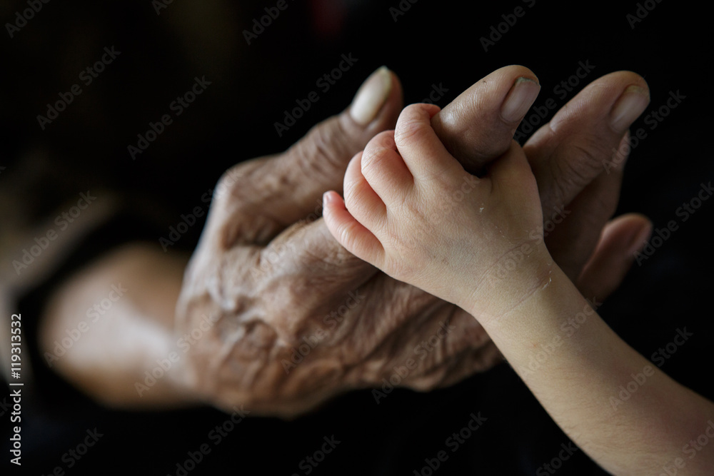 Fototapeta premium Grandmother holding Grandchild (Soft focus and blurry)