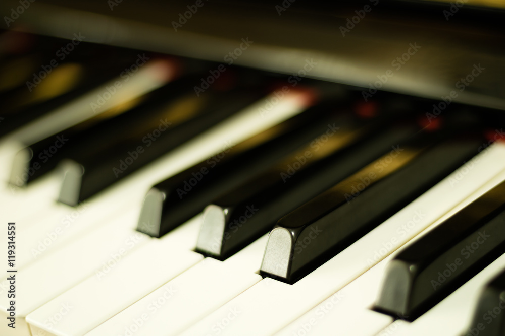 Close-up piano keys background with selective focus Close-up piano keys background with selective focus