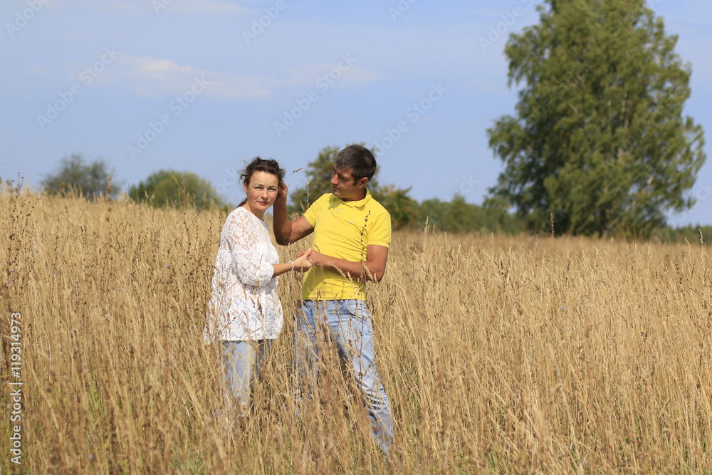 Beautiful couple outdoors in a summer day Beautiful couple outdoors in a summer day
