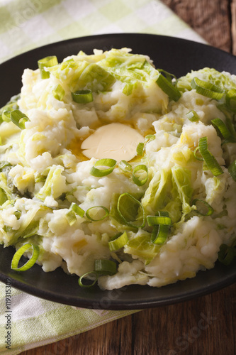 Homemade Irish Potato Colcannon with Greens and butter macro. Vertical

