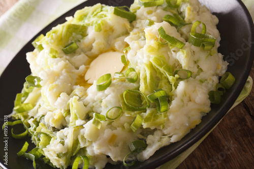 Irish cuisine: colcannon mashed potatoes with cabbage and butter macro. Horizontal
