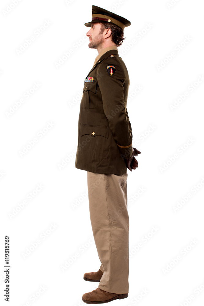 Portrait of a serviceman with hands behind back Portrait of a serviceman with hands behind back
