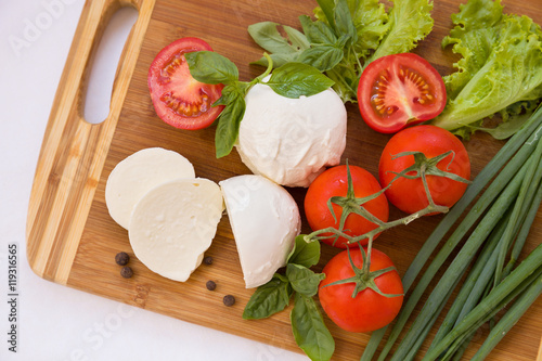 Homemade Organic Mozzarella Cheese with Tomato and Basil and onions -