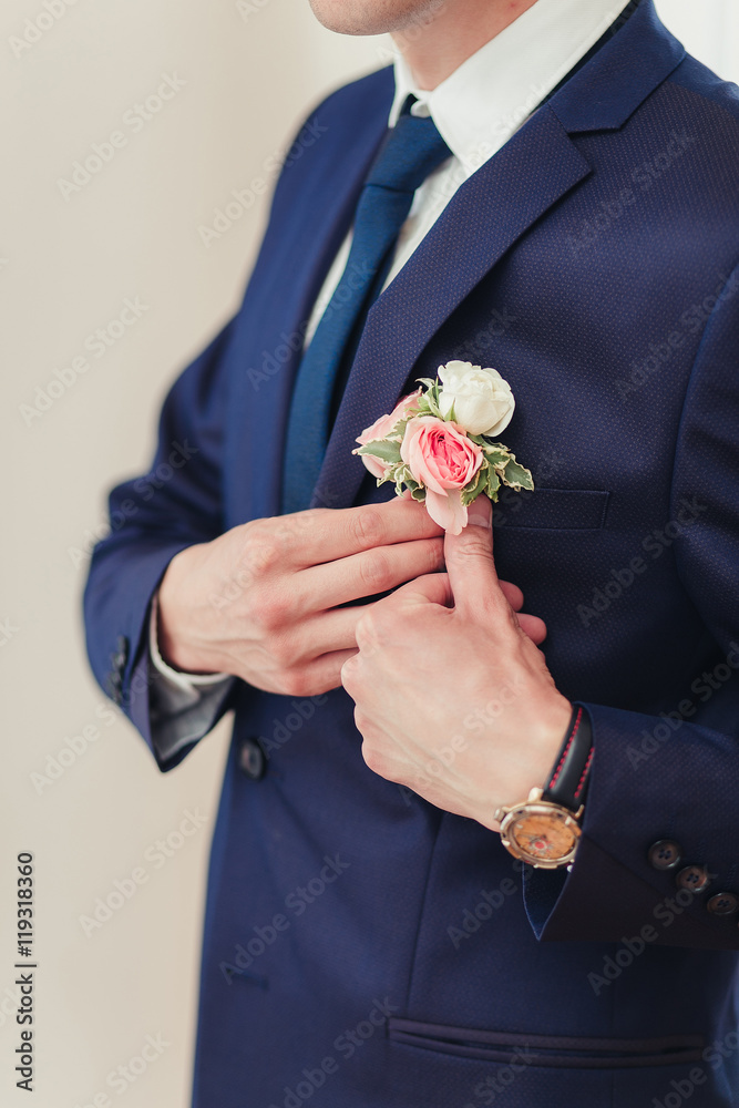 Hands of wedding groom getting ready in suit Hands of wedding groom getting ready in suit