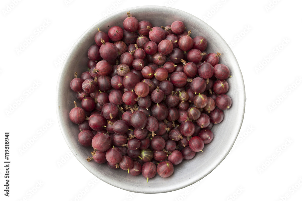 Red gooseberries in a metal bowl on a white background . Red gooseberries in a metal bowl on a white background .