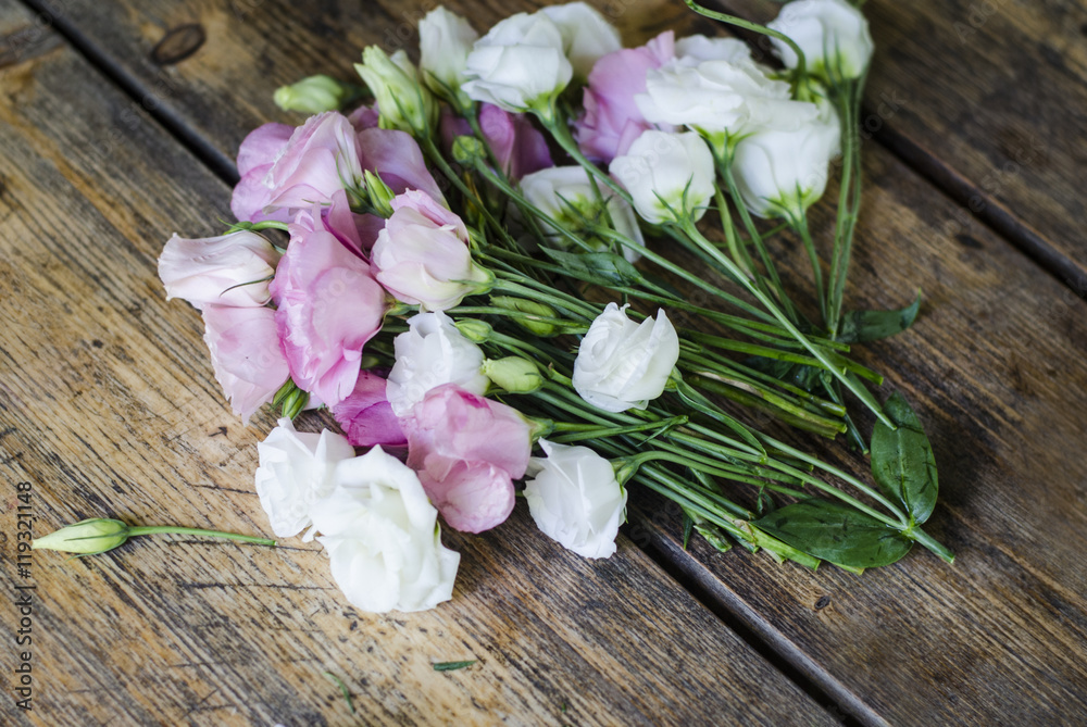 Floral bouquet of roses on a wooden background. Floral bouquet of roses on a wooden background.