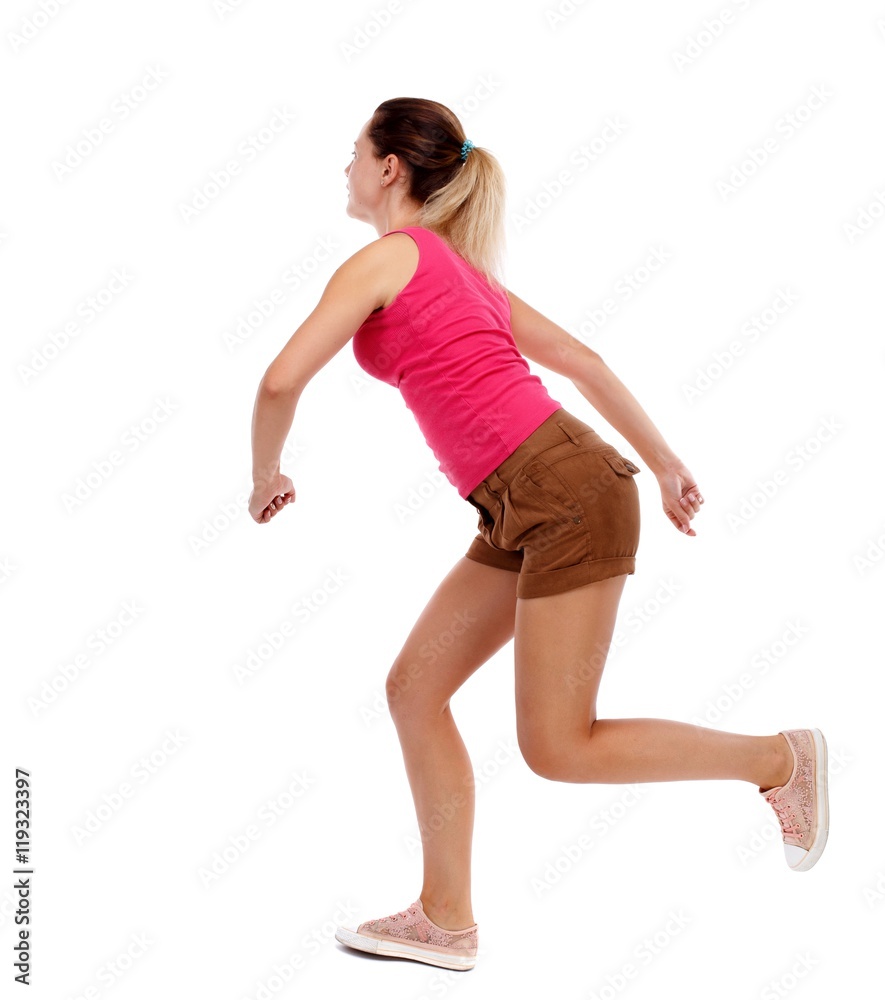 side view woman start position. Sport blond in brown shorts running sprint. side view woman start position. Sport blond in brown shorts running sprint.
