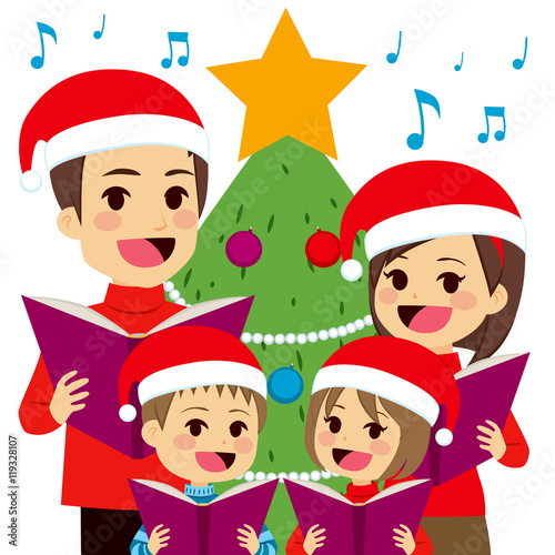 Happy family singing carols in front of Christmas tree at home