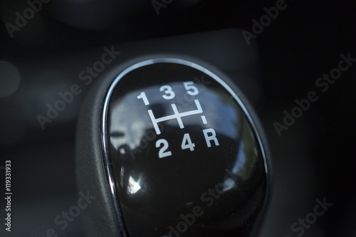 Manual gear stick of a new and modern car.