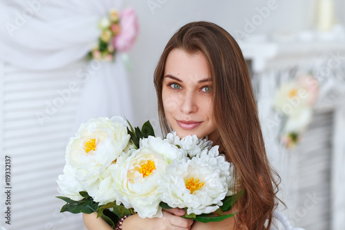 Beautiful girl with a bouquet flowers