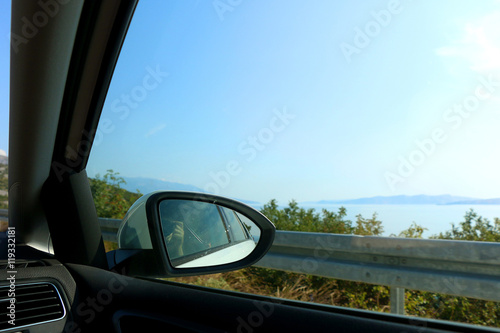 Taking a photo through a car window during a roadtrip. © jelena990