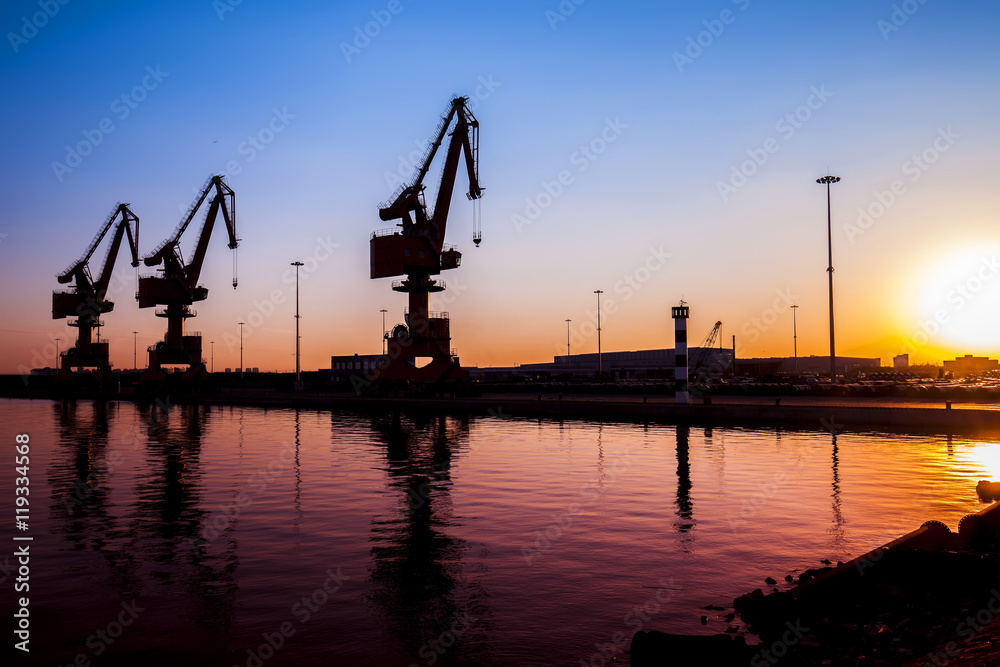 In the evening, gantry crane at the dock