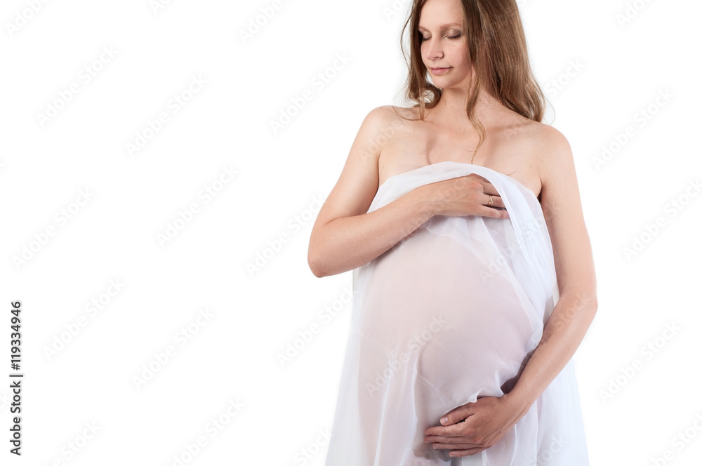 pregnant girl is covered with a thin tulle and hugs your belly pregnant girl is covered with a thin tulle and hugs your belly