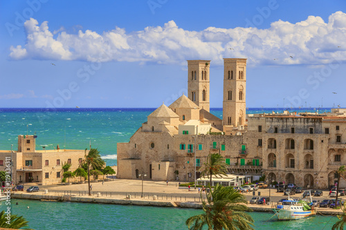 View of  Molfetta old town: the harbor and the Old Cathedral of St. Conrad (Duomo Vecchio of San Corrado).ITALY(Apulia).Old Cathedral of Molfetta in Romanesque style. photo
