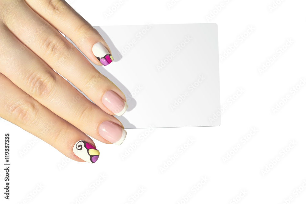 Obraz premium Female hand with manicure holding card isolated on white background
